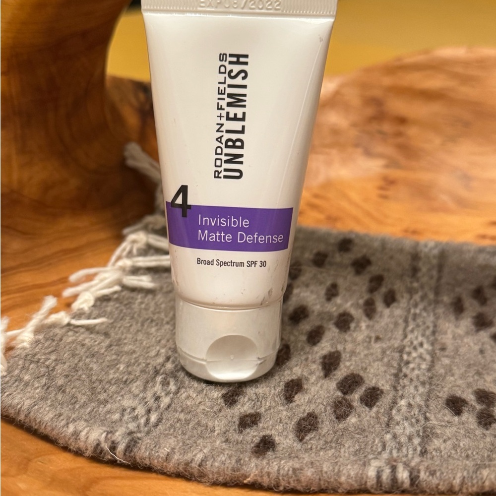 Rodan + Fields Unblemish SPF 30 - Purple and White
